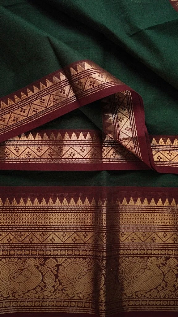 Green Kanchipuram sari with a gold temple border