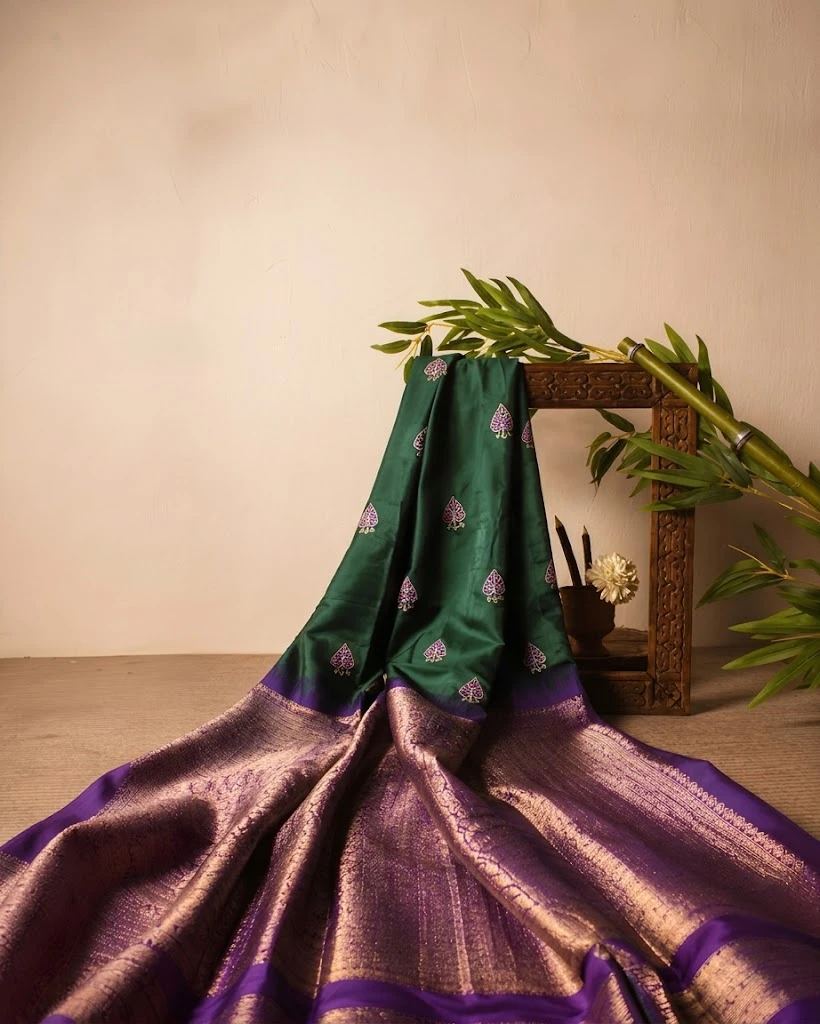Green saree with violet and gold peacock border