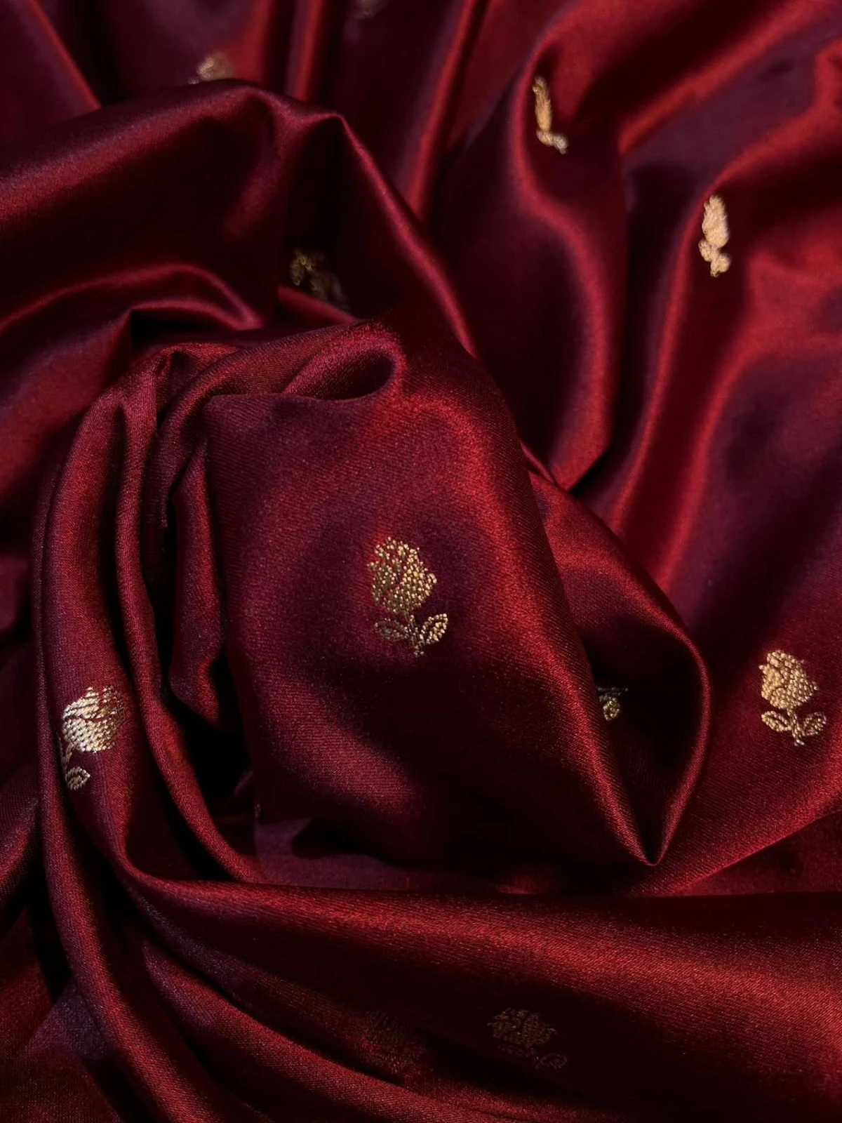 Burgundy satin with small gold buttas